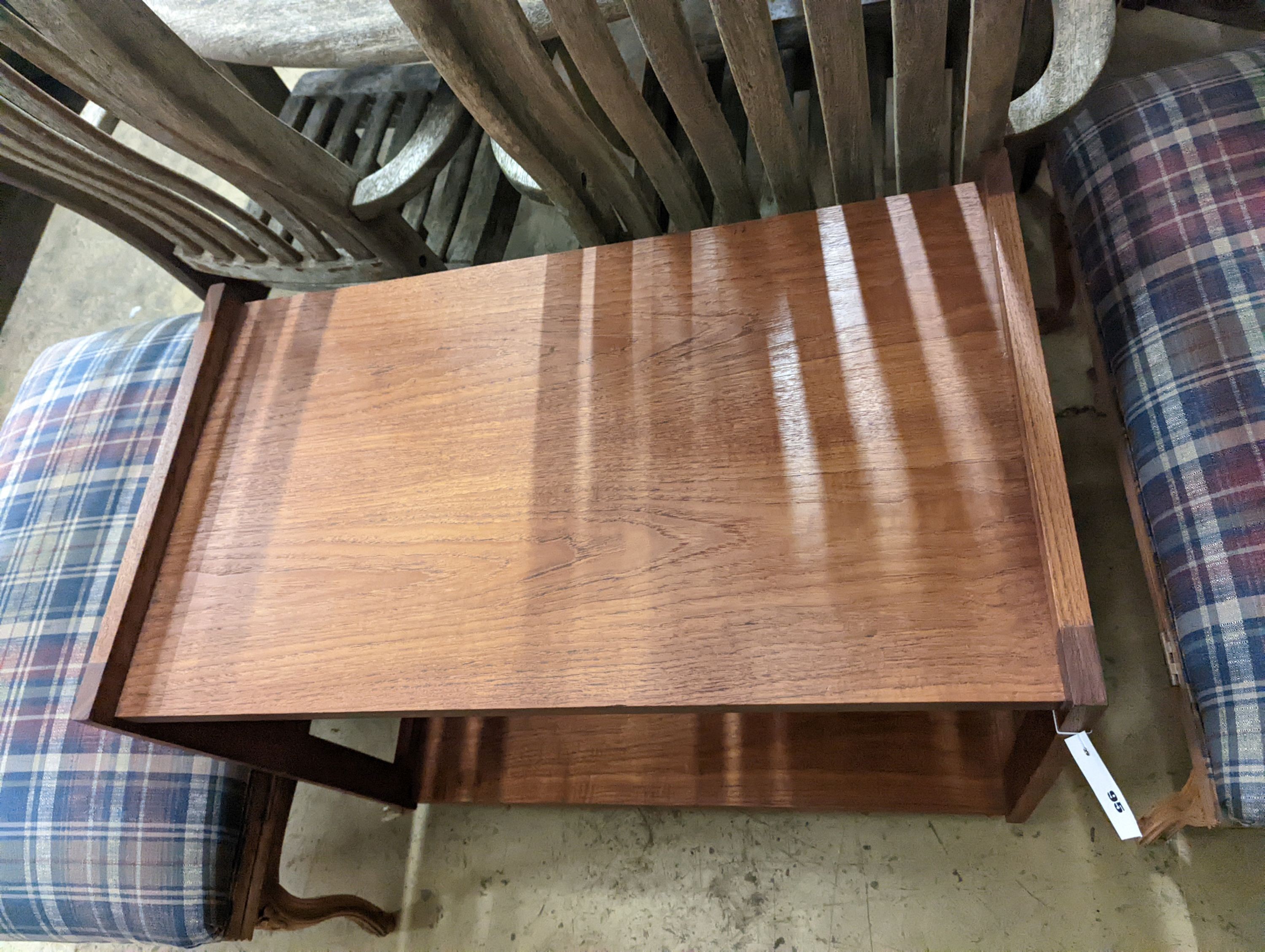 A 1960's rectangular teak two tier table fitted slides, width 80cm, depth 48cm, height 65cm